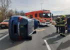 Overturned car blocks busy road, two rescued