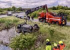 Driver crashes into retention pond, witness rescues woman and child