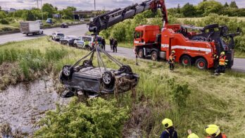 Driver crashes into retention pond, witness rescues woman and child