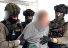 Suspect arrested at Prague airport over online threats of mass violence
